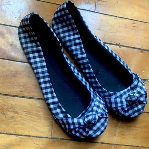 Black and white slip on flats. Purchased three years ago, never worn.